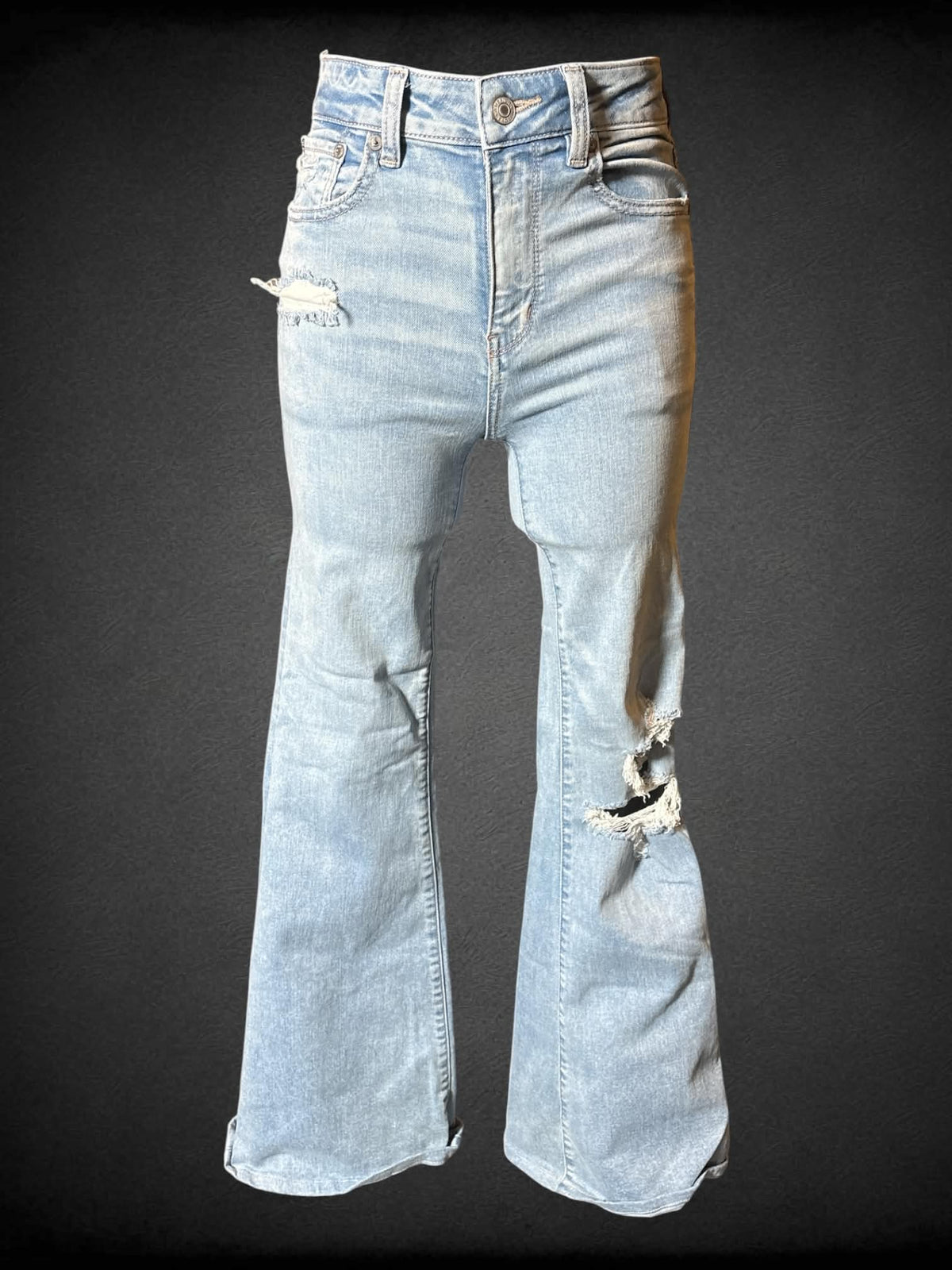 S American Eagle light blue jeans with distressing, pockets, and flared legs