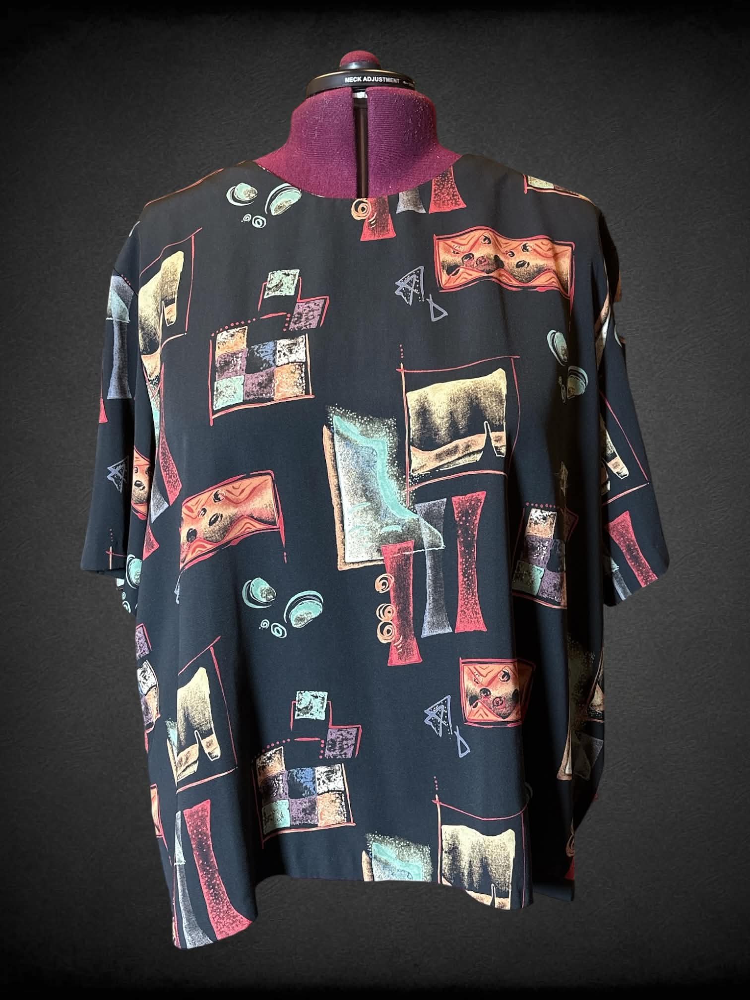 3X Ken Sington Square vintage  black short sleeve top with button/keyhole on back, and multicolor geometric design