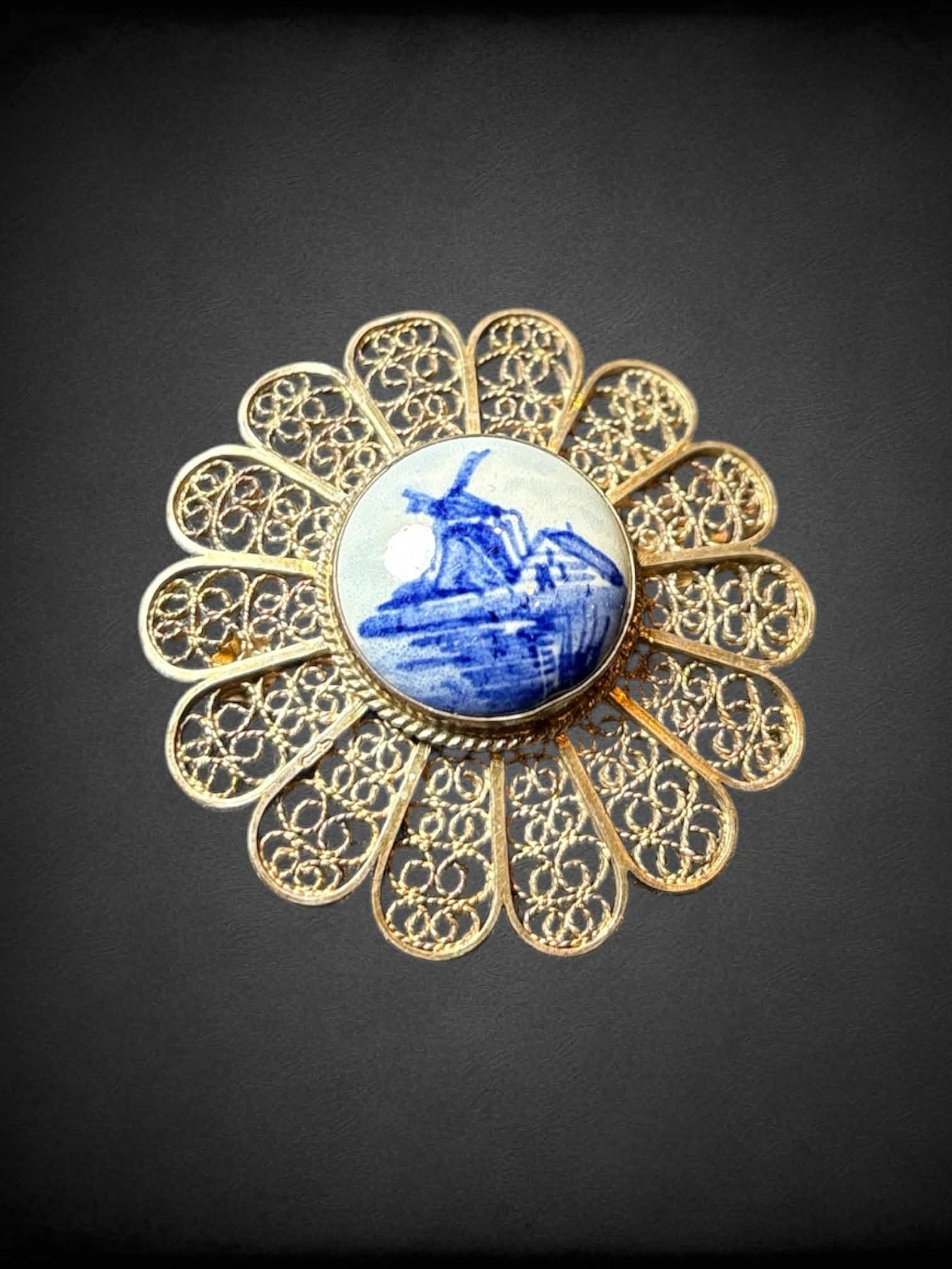 Vintage silver floral brooch with intricate open work wire, and porcelain center
