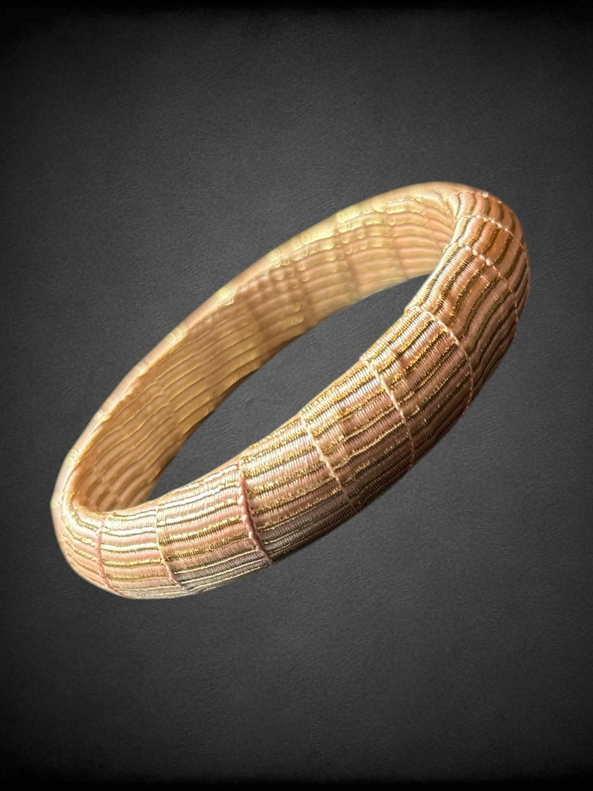 Pink and gold threaded bracelet