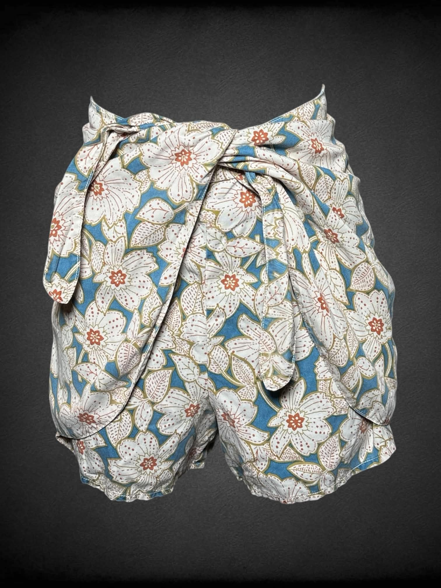 S Anthropologie blue wrap-around shorts with floral design, and zipper on side