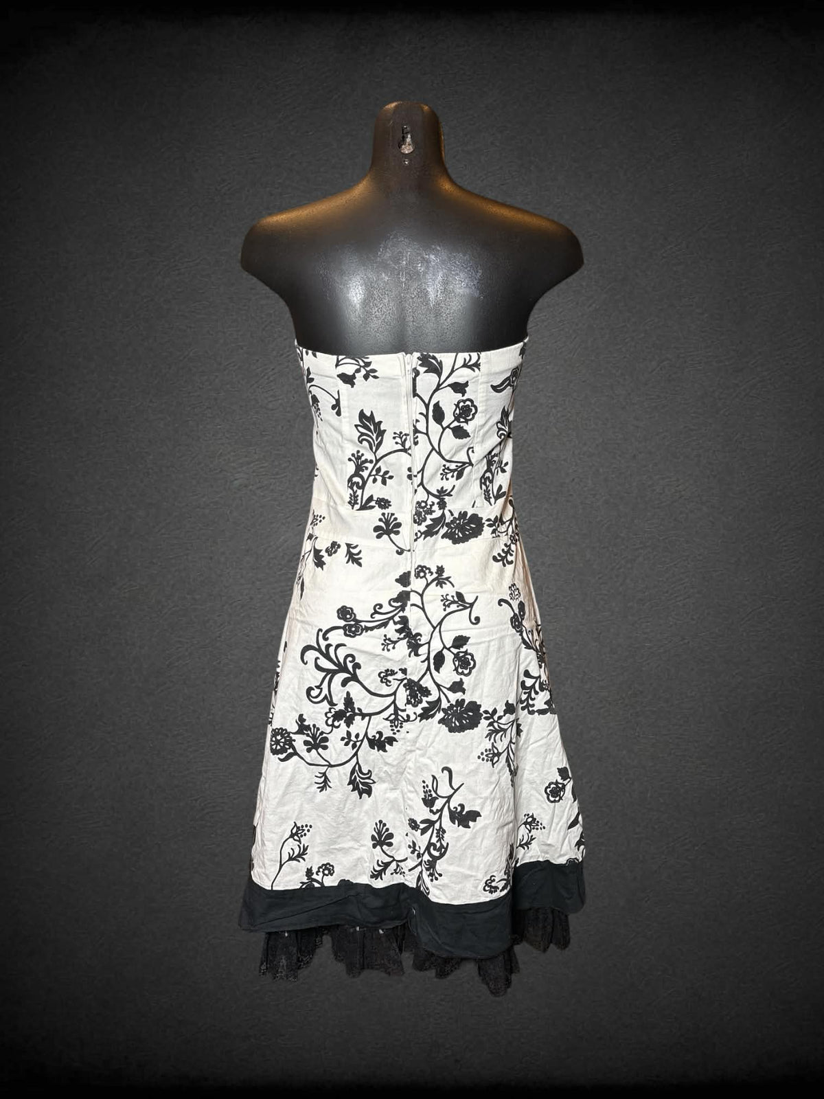 S Twenty One white strapless dress with black floral pattern, lace hemline, and zipper on back