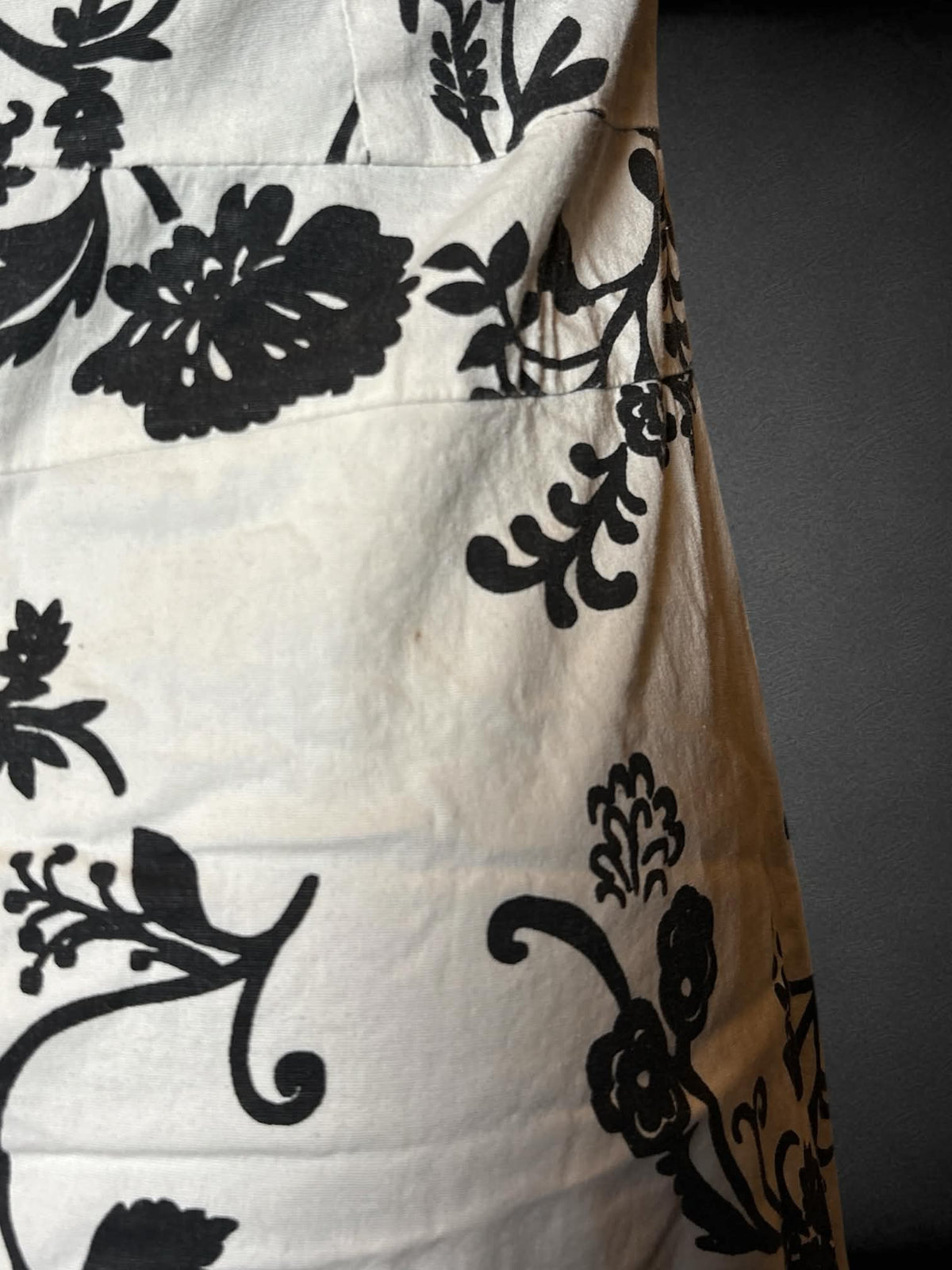 S Twenty One white strapless dress with black floral pattern, lace hemline, and zipper on back