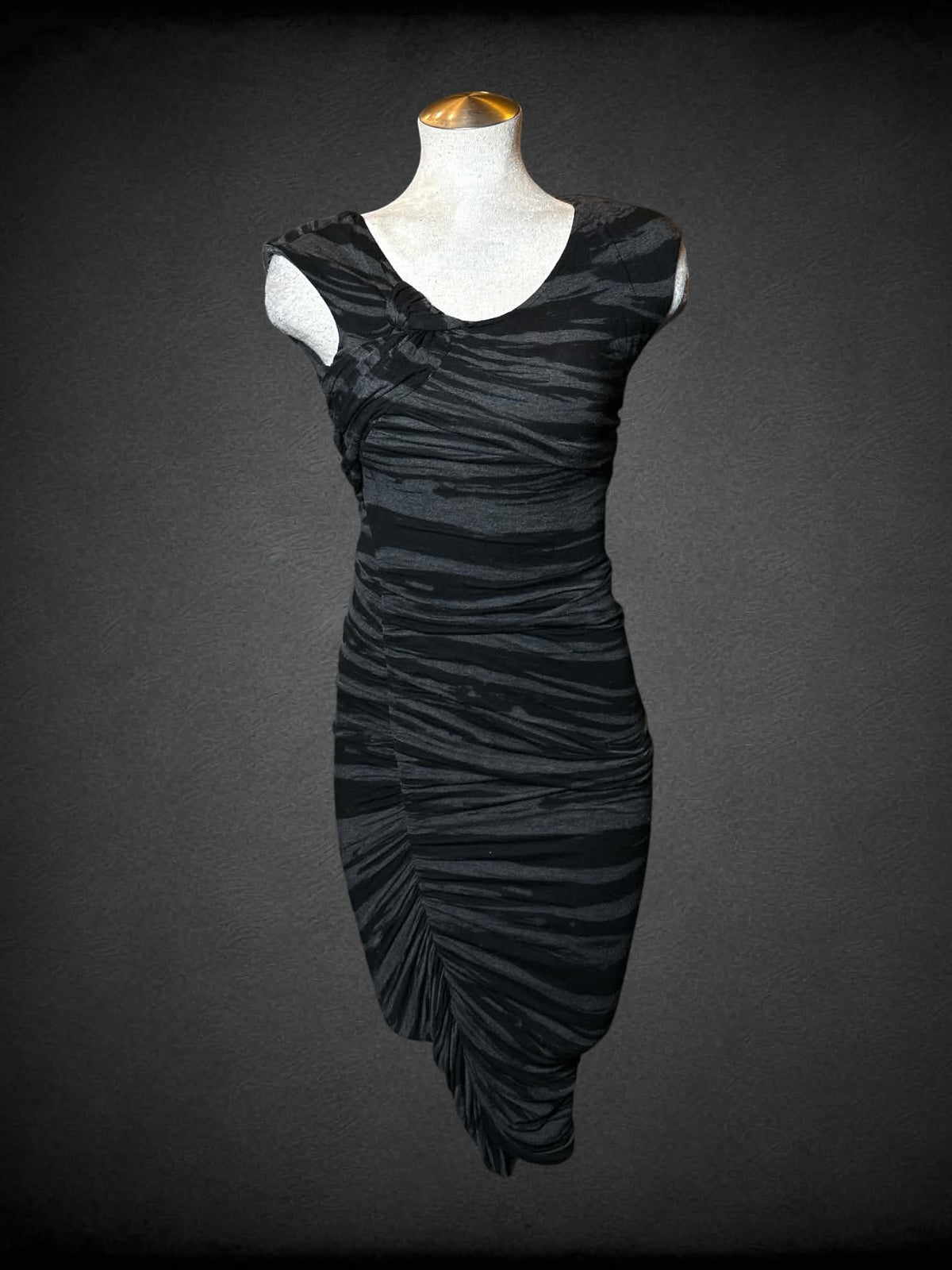 L Seduction grey chinched dress with black striped design, and asymmetrical cut