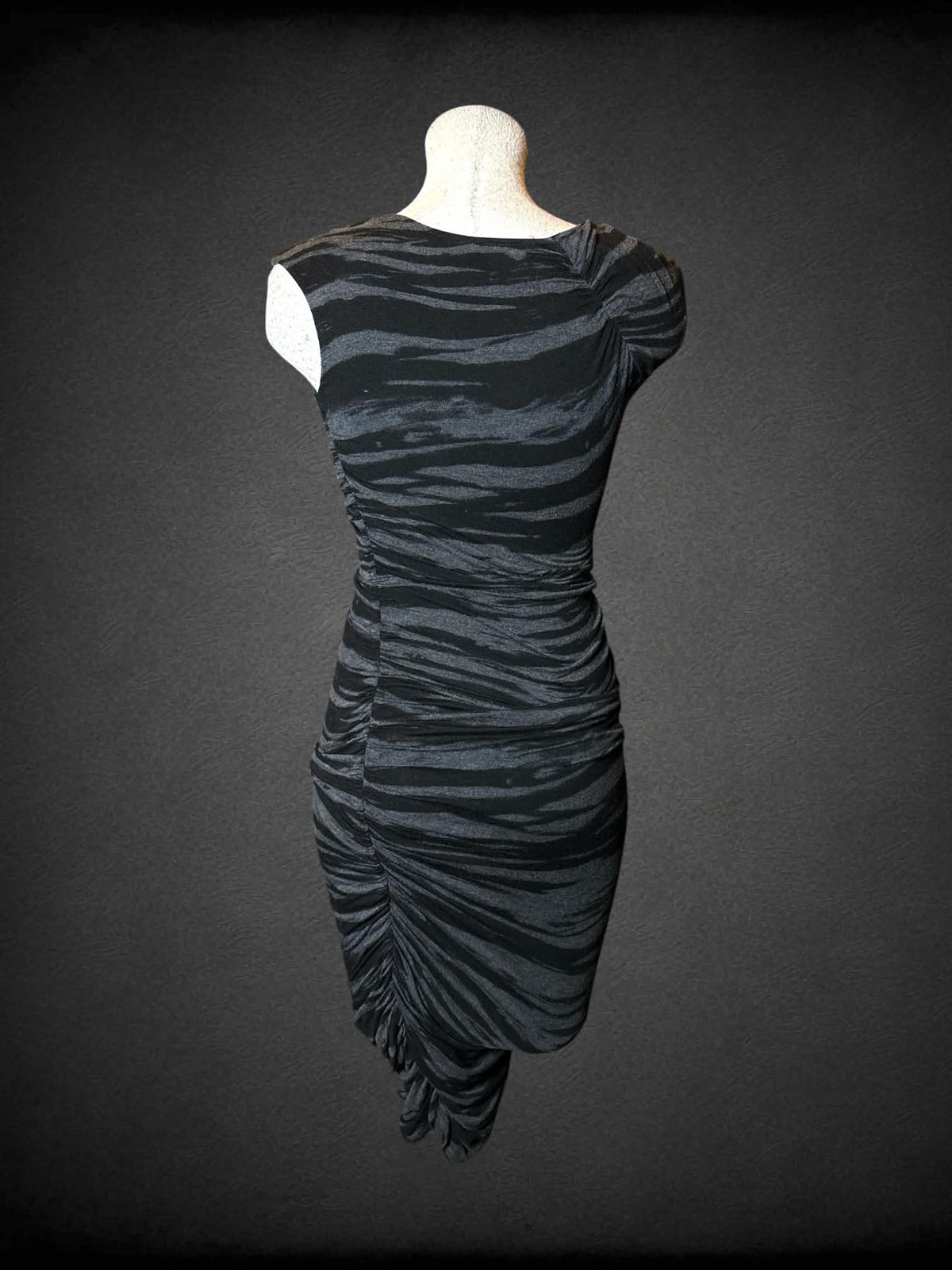 L Seduction grey chinched dress with black striped design, and asymmetrical cut