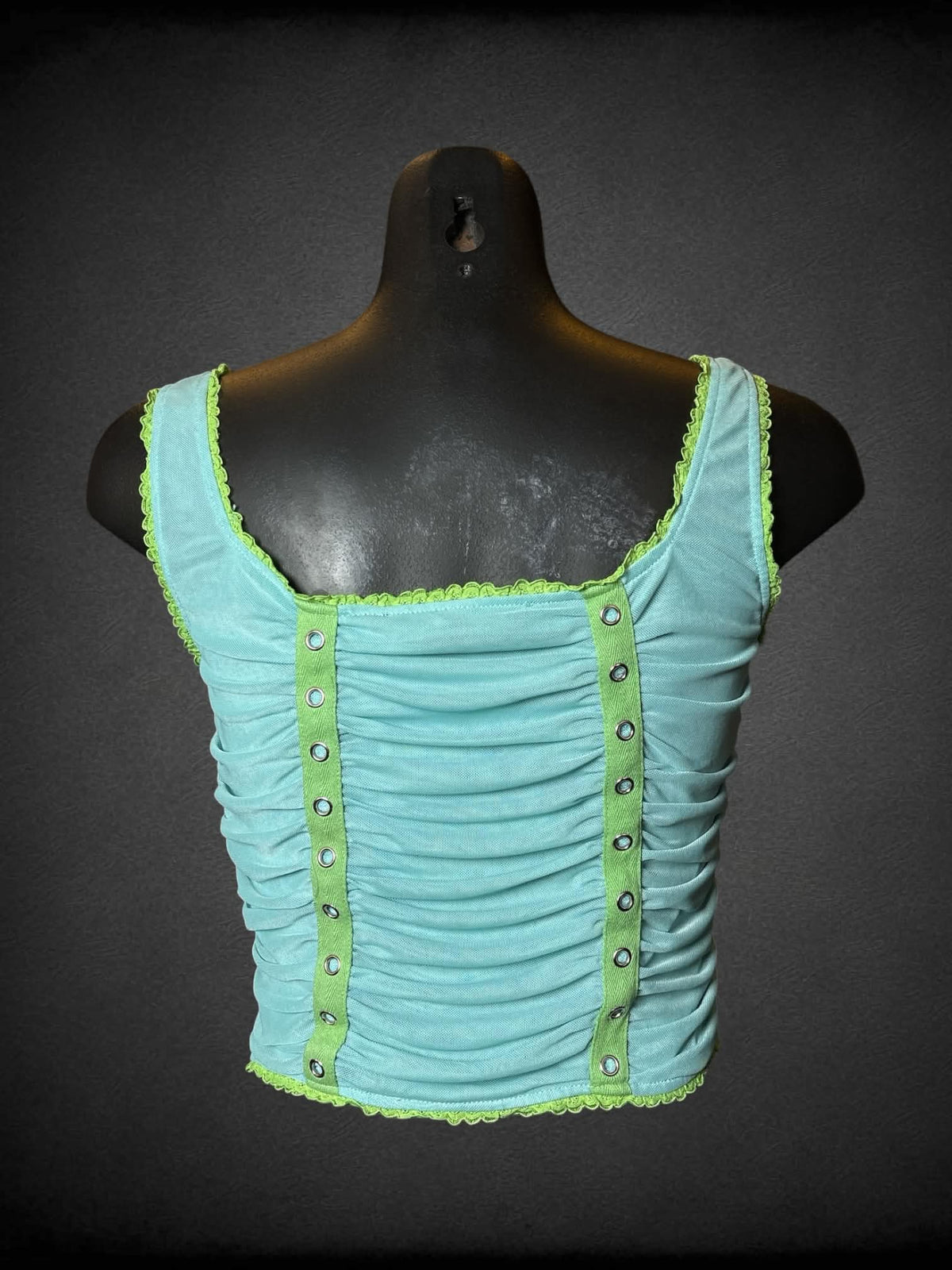 M Tunnel Vision aqua mesh cropped tank top with cinched design, green and metallic detailing, and zipper on side