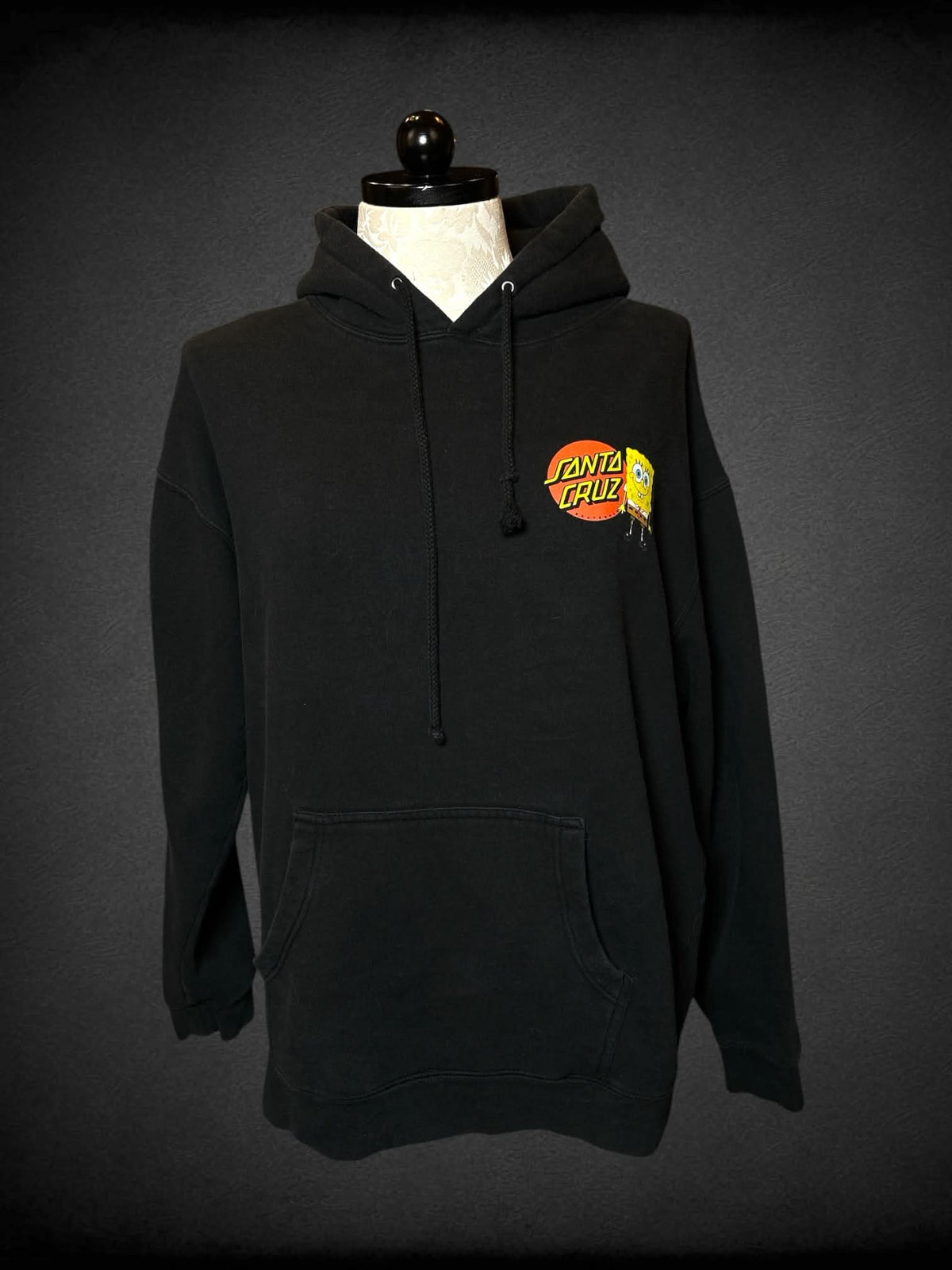 1X Santa Cruz x Nickelodeon black pullover hoodie with “SpongeBob” character logo on back