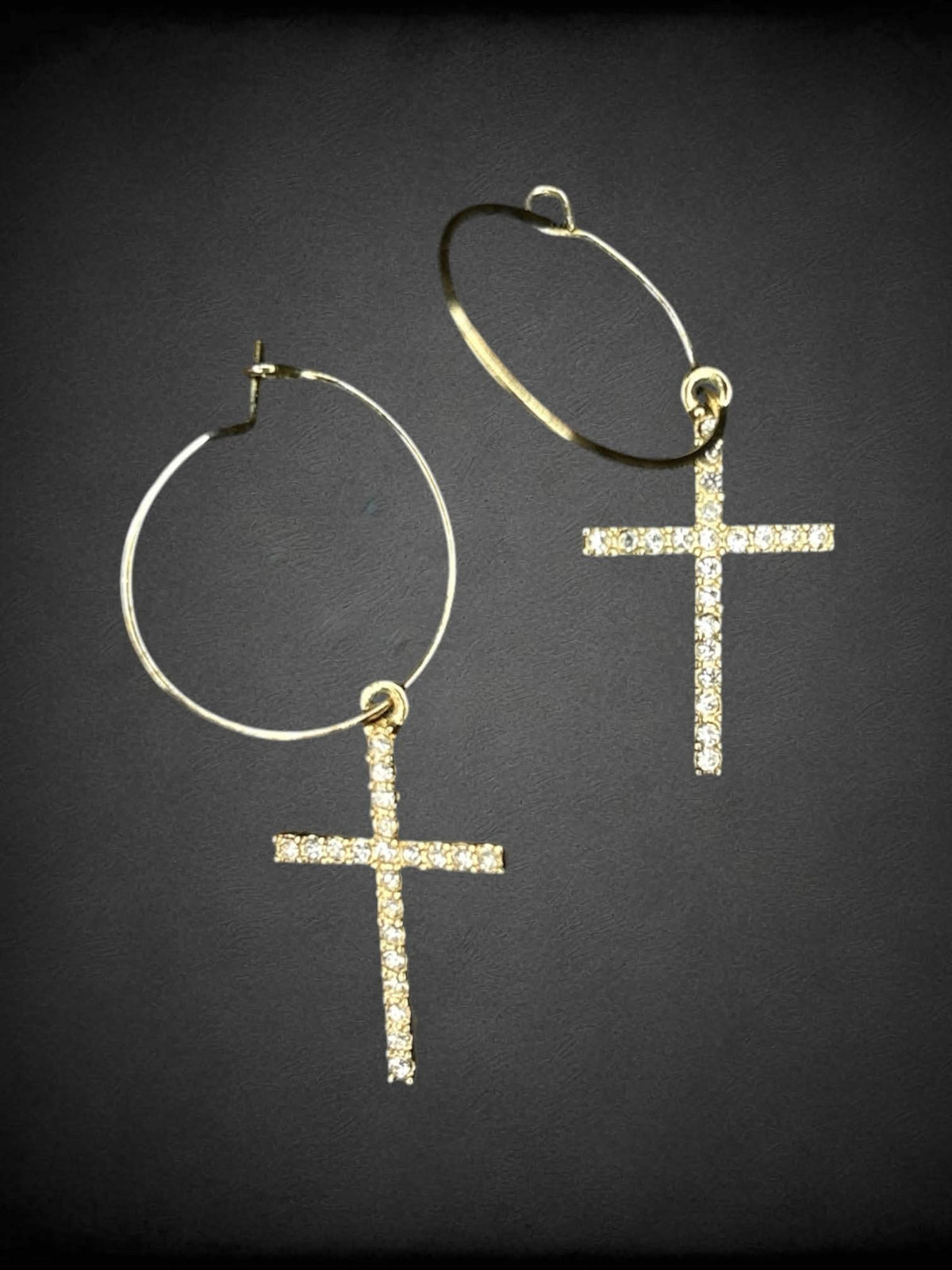 Gold hoop earrings with bejeweled cross charms