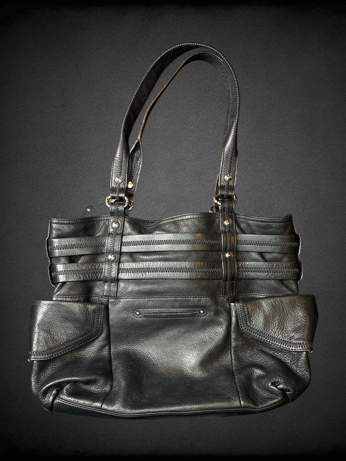 B. Makowsky designer black leather shoulder bag with zipper pockets and magnetic snap button