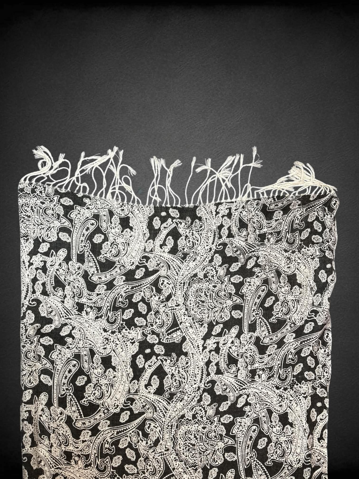 28 x 70 inch black scarf/shawl with white paisley design, and tassels