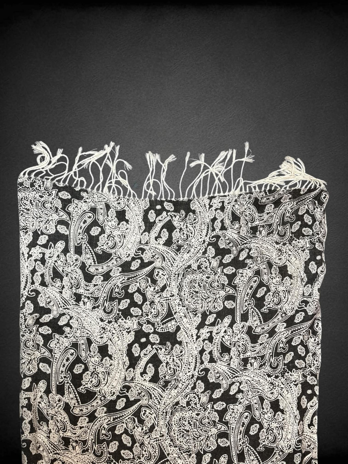 28 x 70 inch black scarf/shawl with white paisley design, and tassels