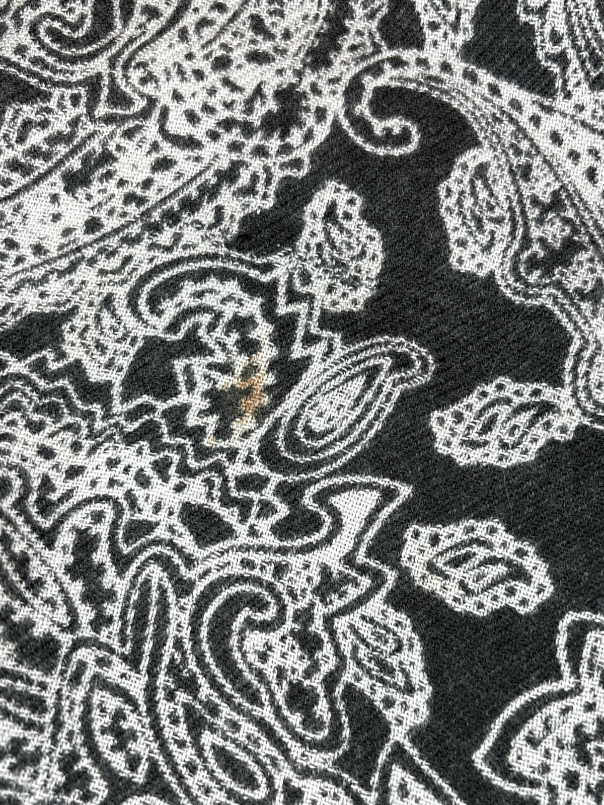 28 x 70 inch black scarf/shawl with white paisley design, and tassels