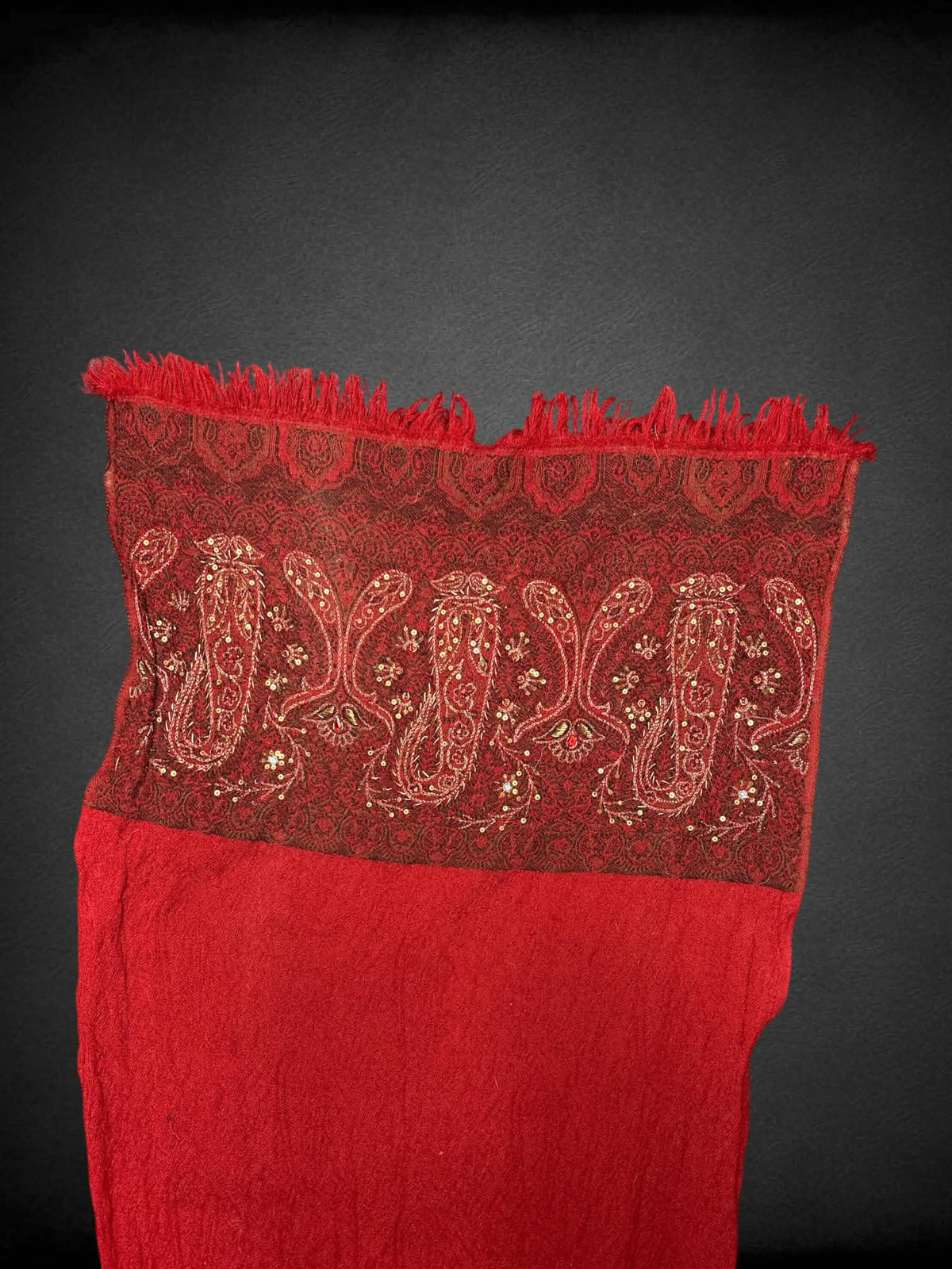 19 x 77 inch red scarf with embroidered paisley design, and tassels on hemline