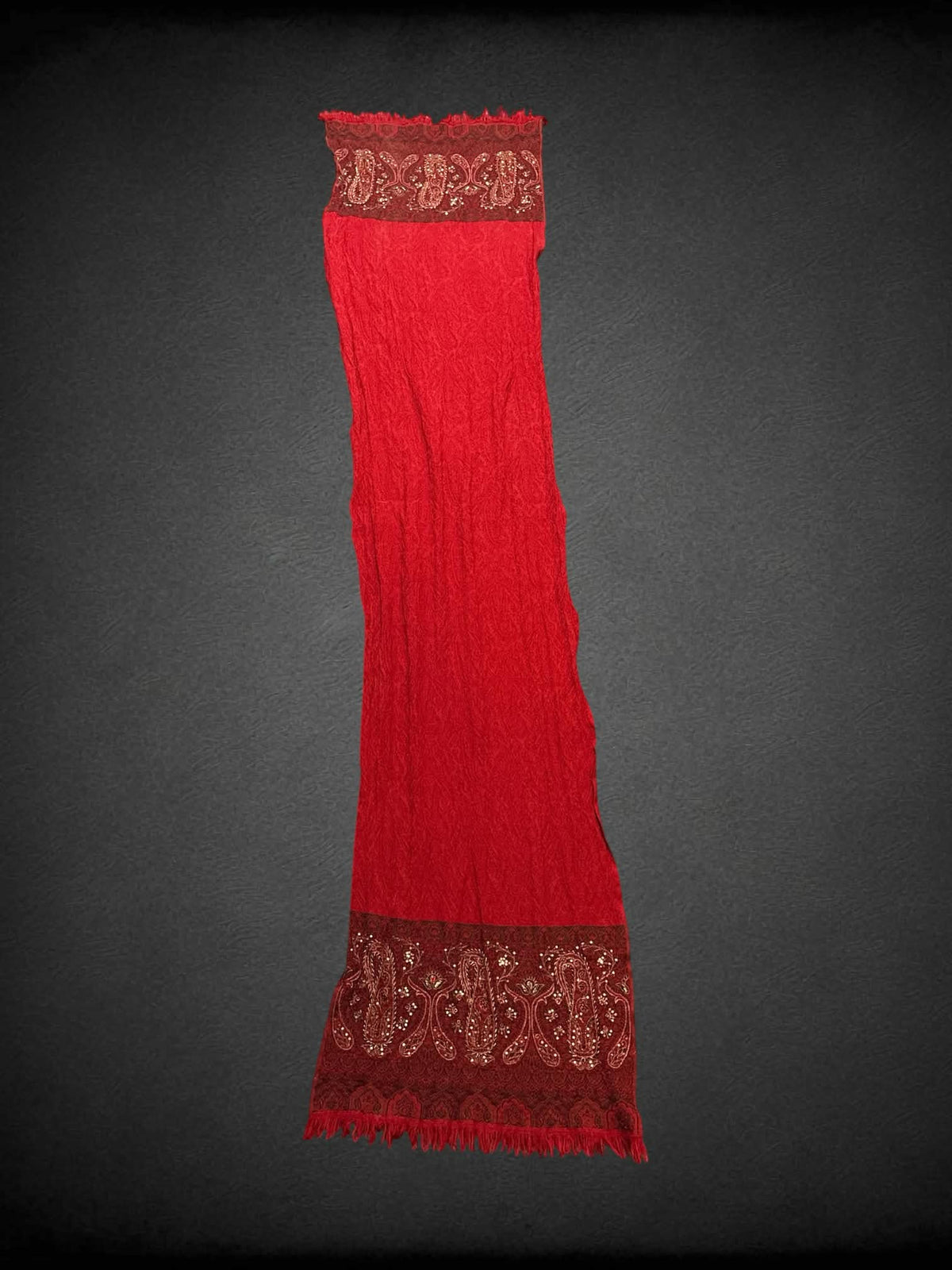 19 x 77 inch red scarf with embroidered paisley design, and tassels on hemline