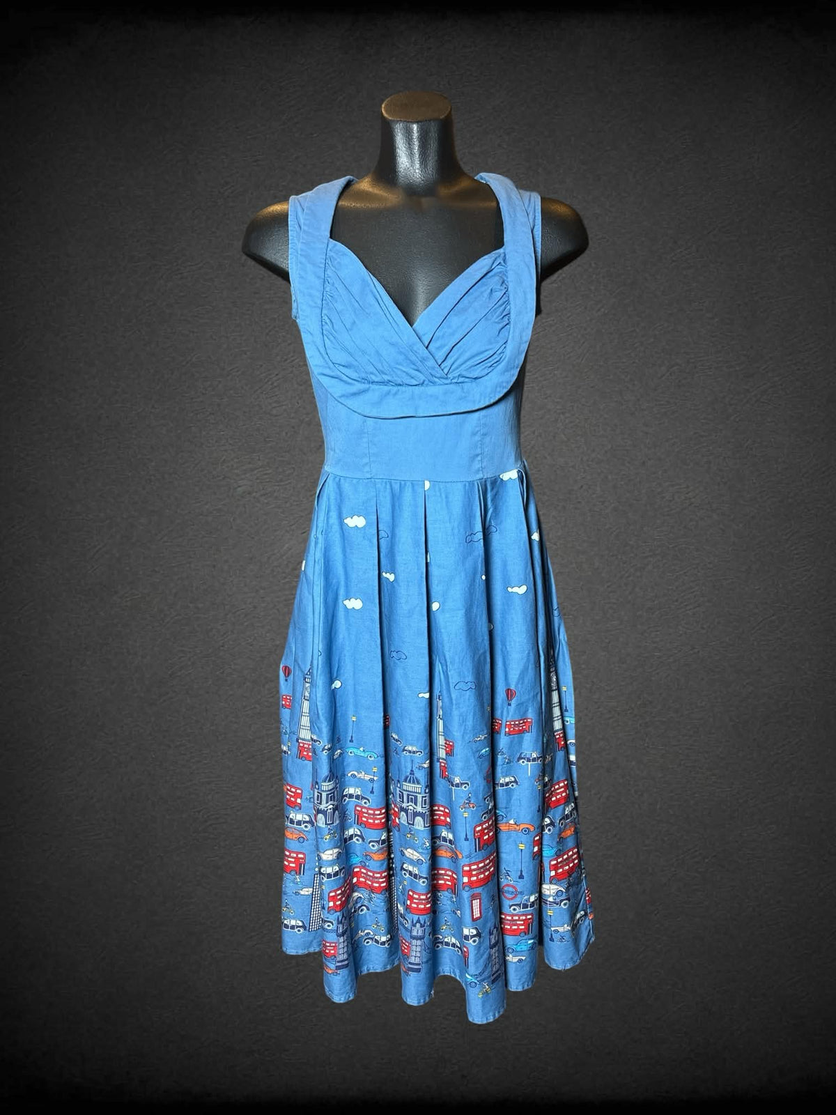 M blue dress with pleated skirt, city London pattern, and zipper on back