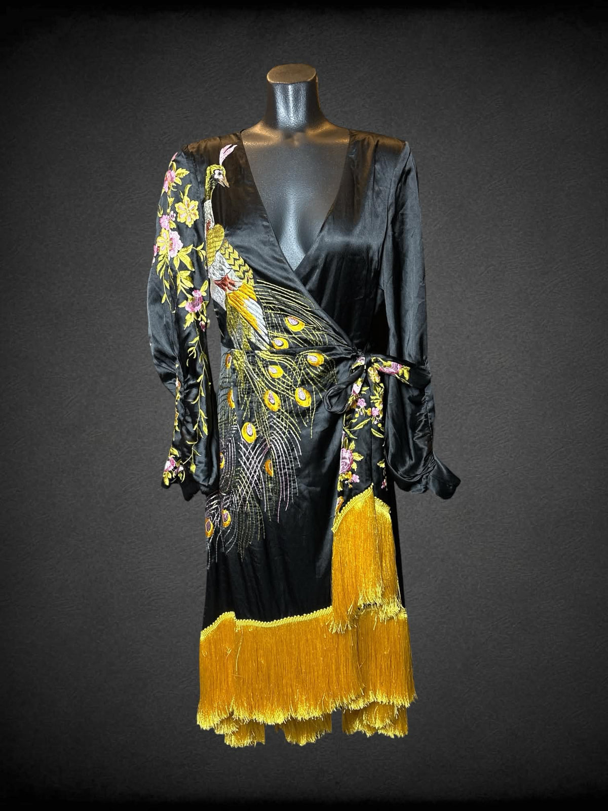 M ASOS black wrap-around robe dress with embroidered peacock and flower design, and fringed hemline
