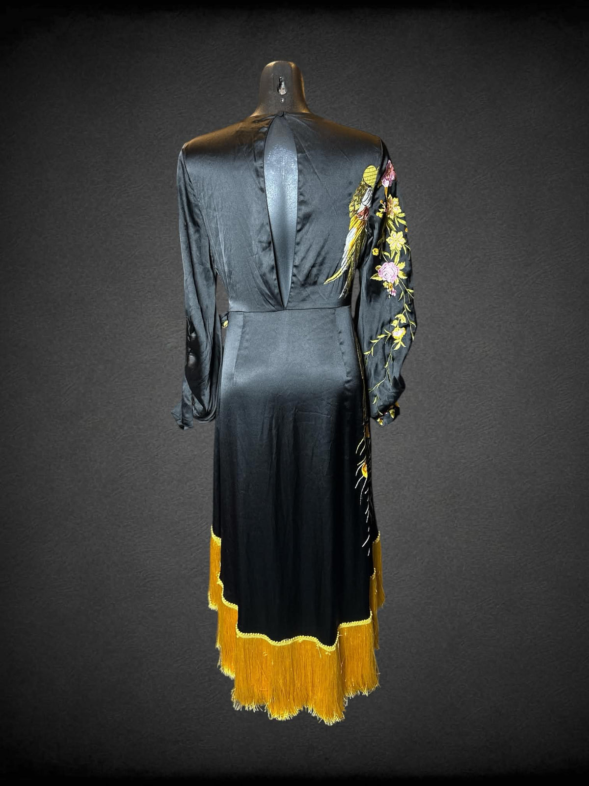 M ASOS black wrap-around robe dress with embroidered peacock and flower design, and fringed hemline