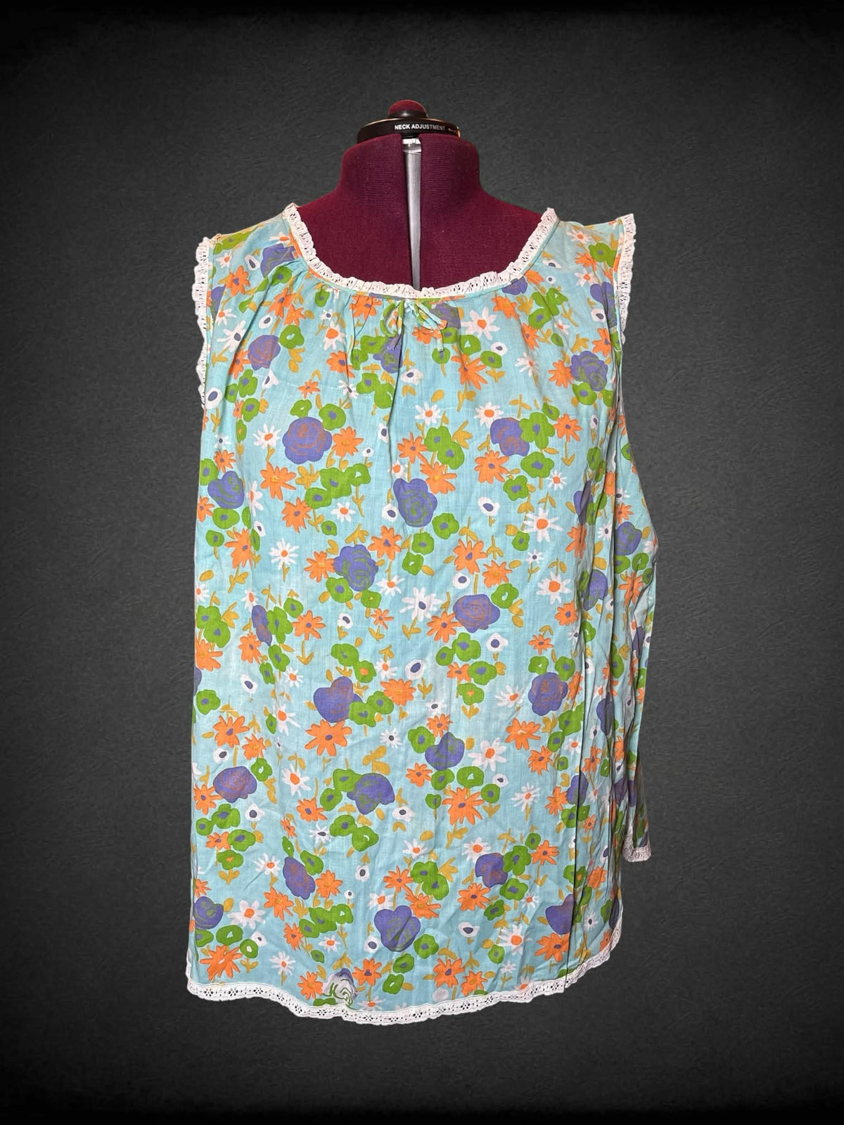 3X light blue flowy blouse with lace hemline, and floral pattern