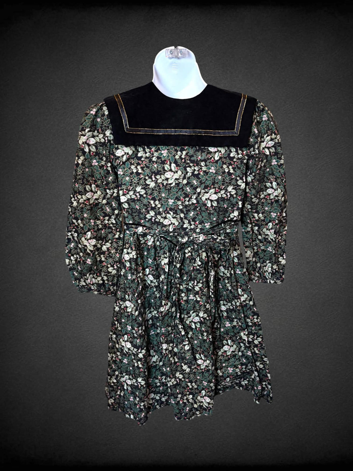 XXS Polly Flinders vintage black & green short dress with velvet collar, floral pattern, zipper on front, and tie around waist