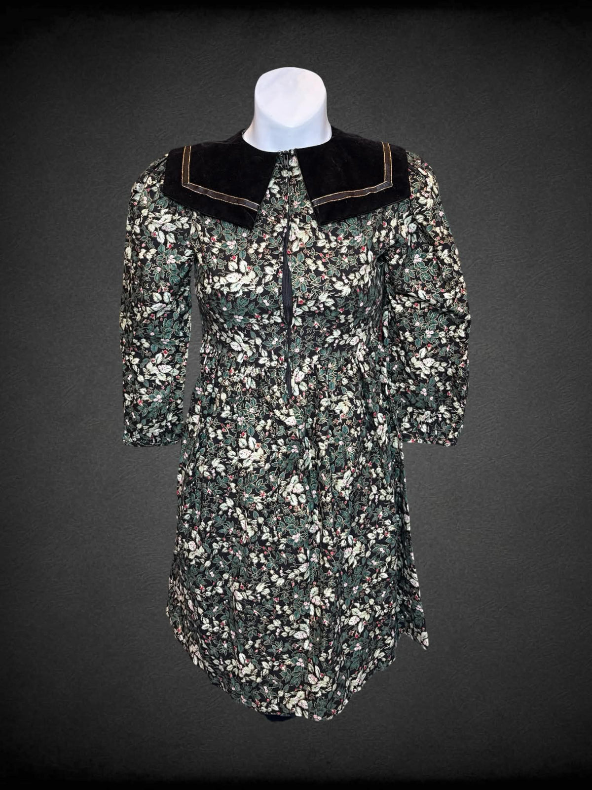 XXS Polly Flinders vintage black & green short dress with velvet collar, floral pattern, zipper on front, and tie around waist