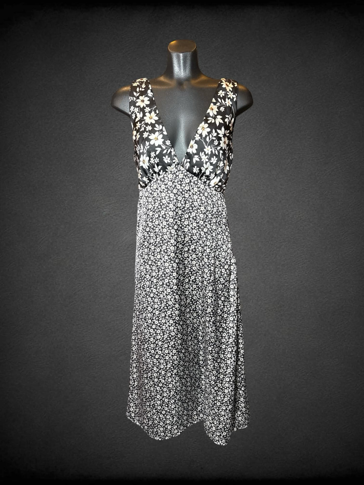 M Altar’d State black dress with white daisy pattern, and zipper on side