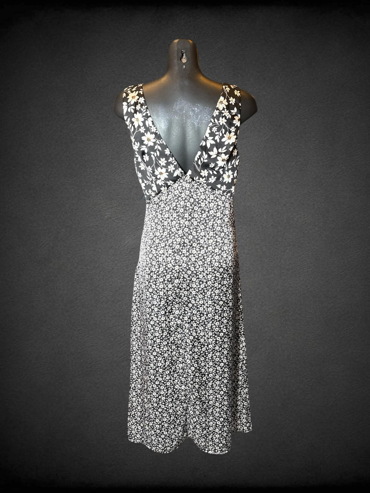 M Altar’d State black dress with white daisy pattern, and zipper on side