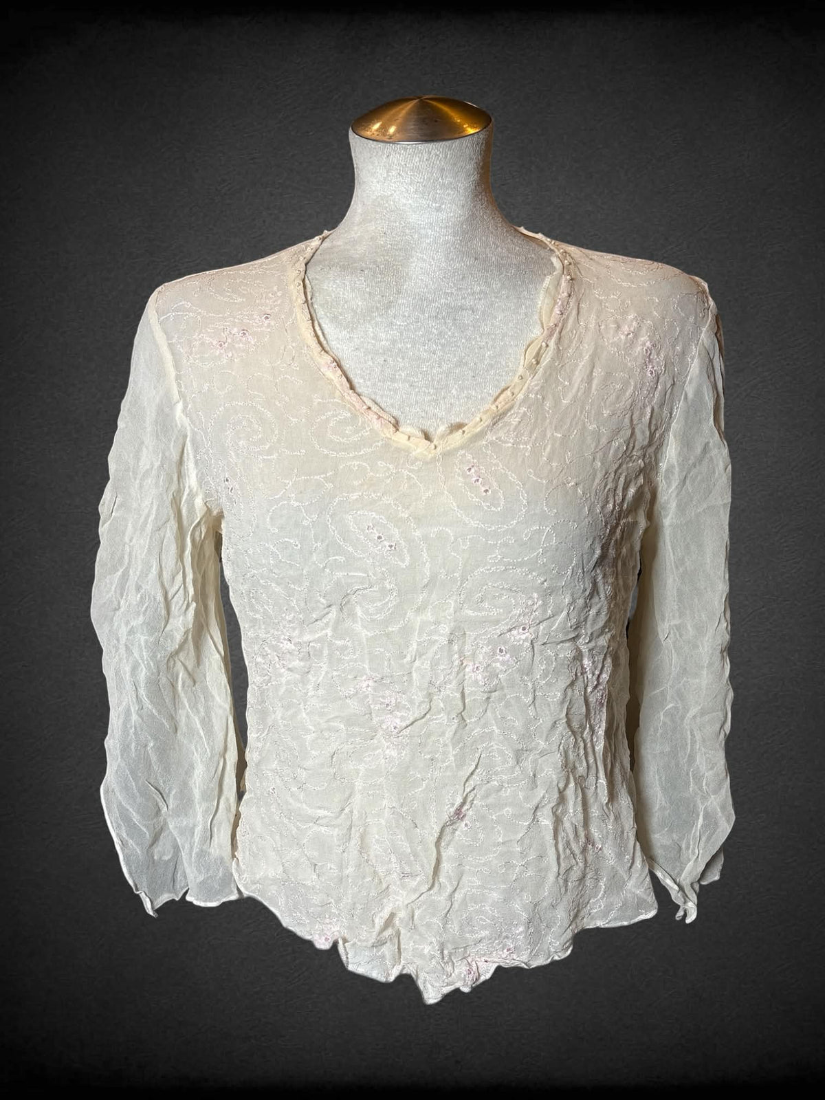 L Tess vintage cream sheer silk blouse with bell sleeves, beaded detailing on neckline, and pink paisley embroidery on front