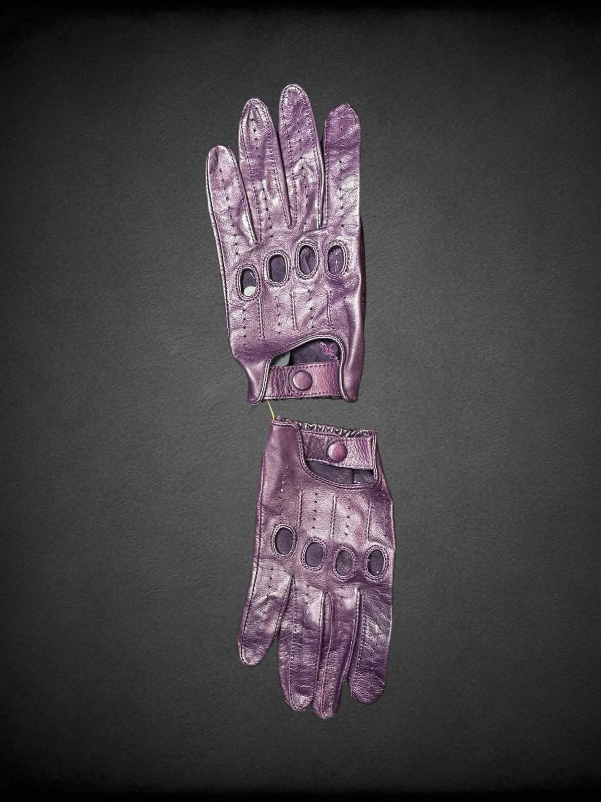Gravelly Orsini purple leather gloves with cutout design on nuckles, and snap button