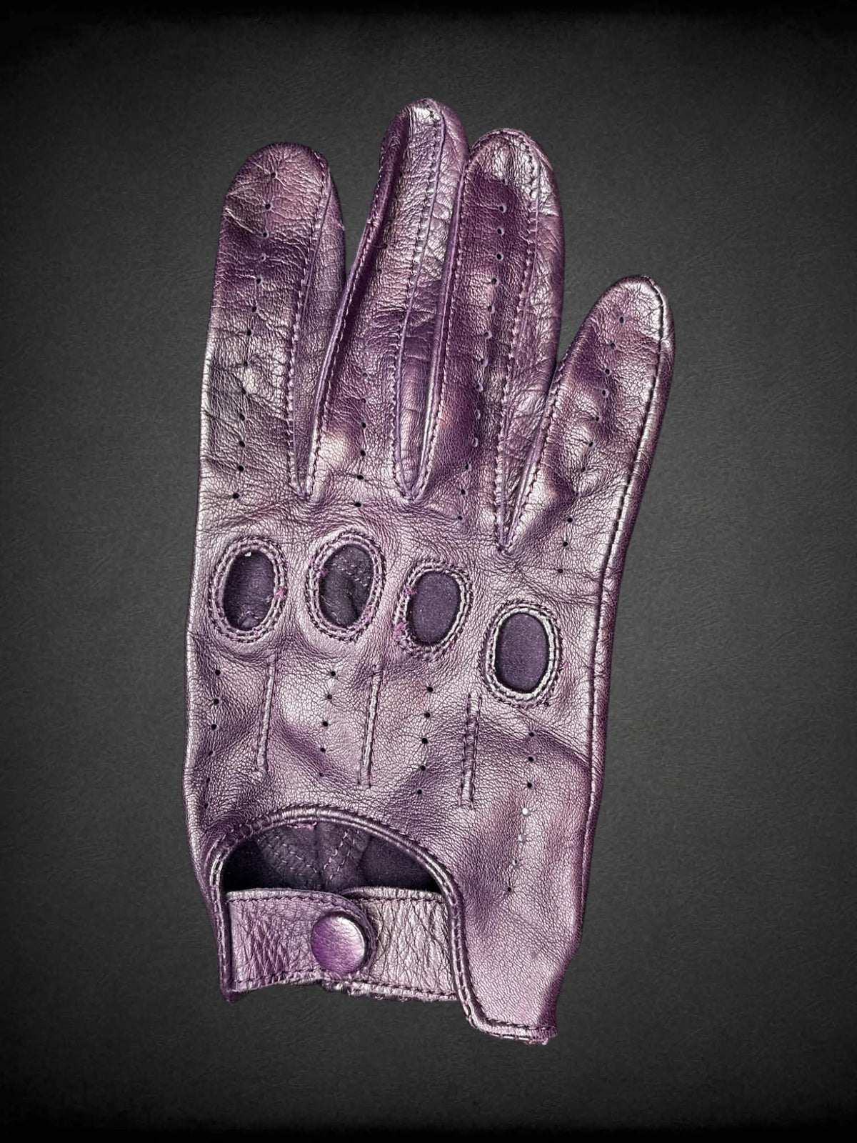 Gravelly Orsini purple leather gloves with cutout design on nuckles, and snap button