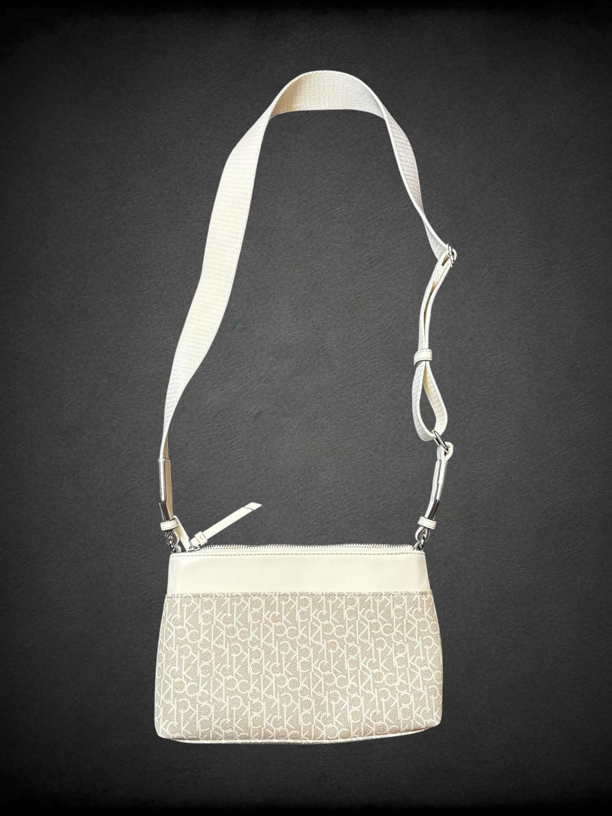 Calvin Klein beige shoulder bag with zipper pockets, and adjustable strap
