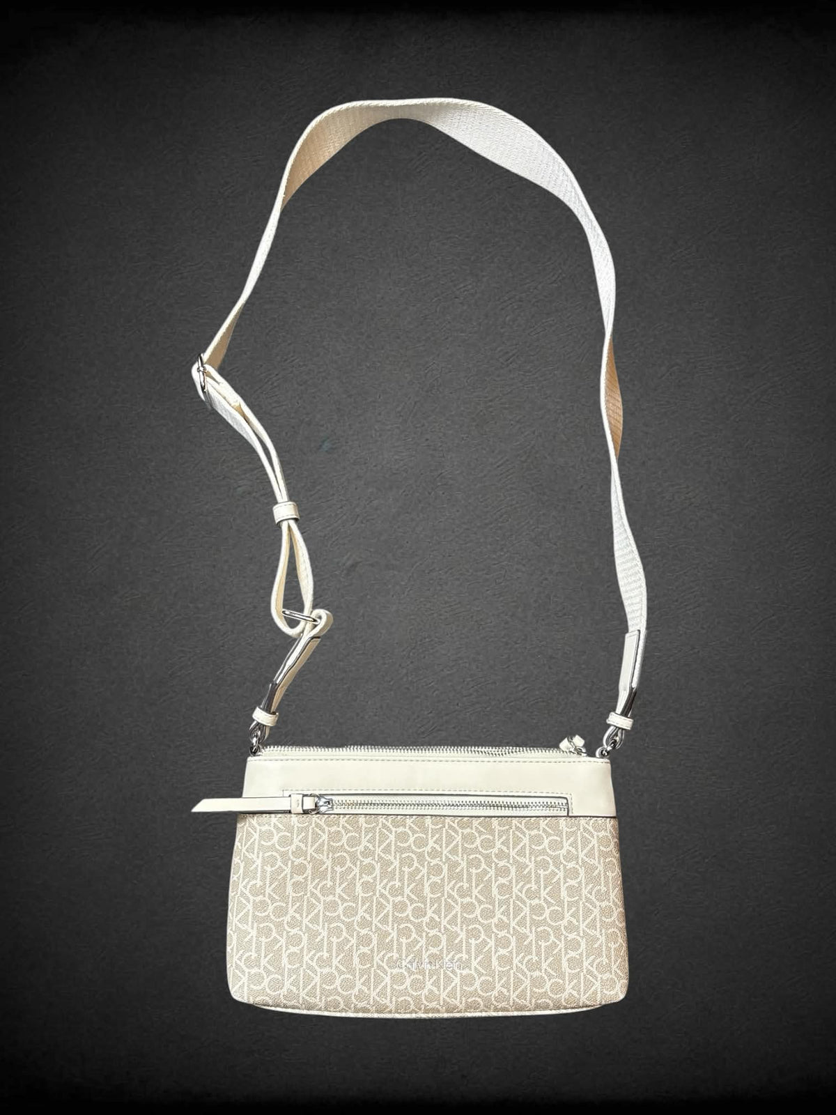 Calvin Klein beige shoulder bag with zipper pockets, and adjustable strap