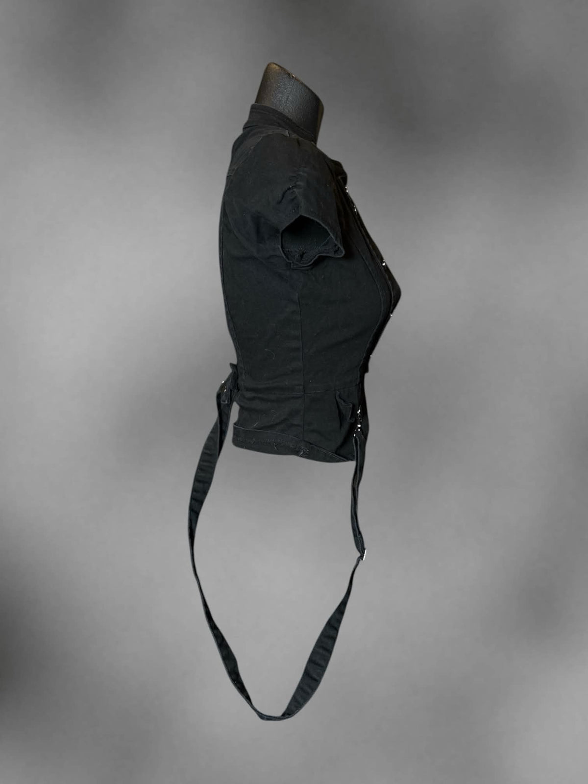 S black fitted blazer top with clasp on front, decorative buttons, and loop straps