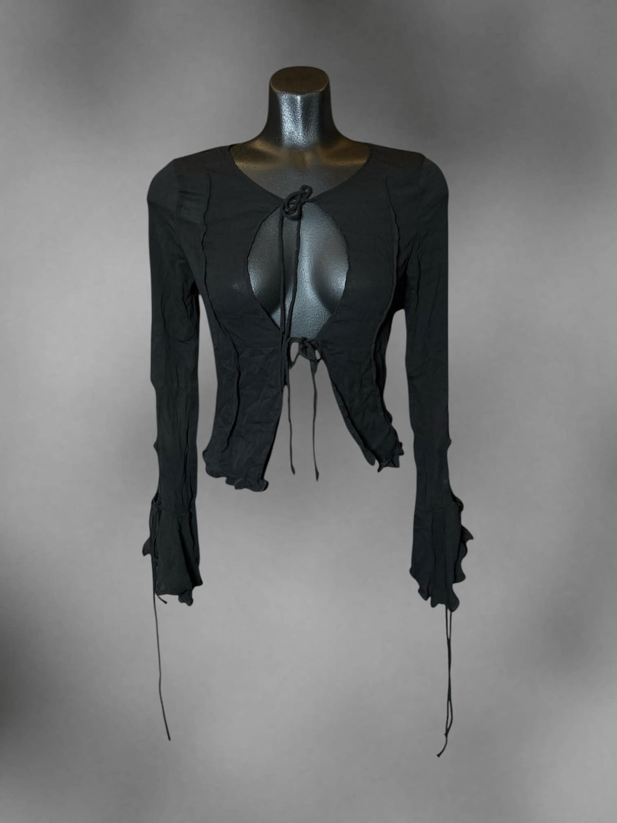 S Rumours black sheer long-sleeve blouse with cutout design on front, and tie up laces on front and sleeves