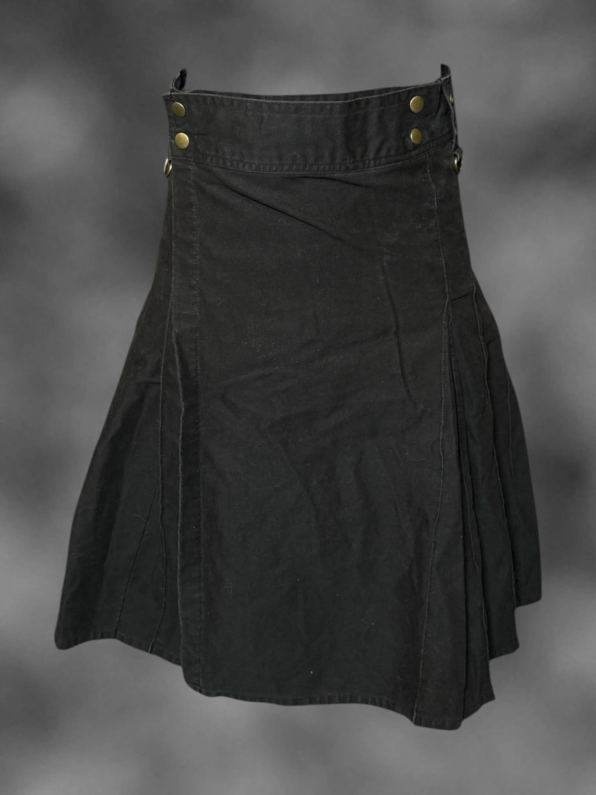 S Damn Near Kilt ‘Em black high-waisted skirt with adjustable wrap-around snap buttons on front, and pleated design on back