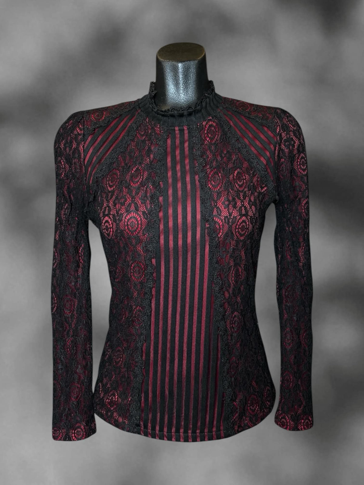 M Feife Dress red long-sleeve blouse with black lace design, ruffle collar, and button on back