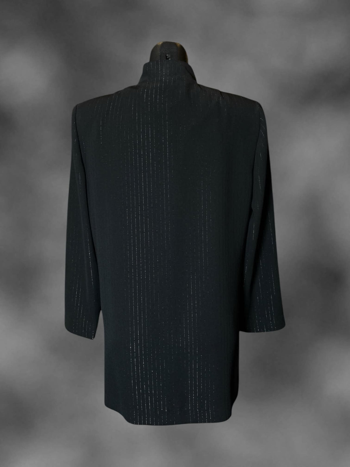 M R&M Richards vintage black coat with striped design, metallic clasps on front, and padded shoulders