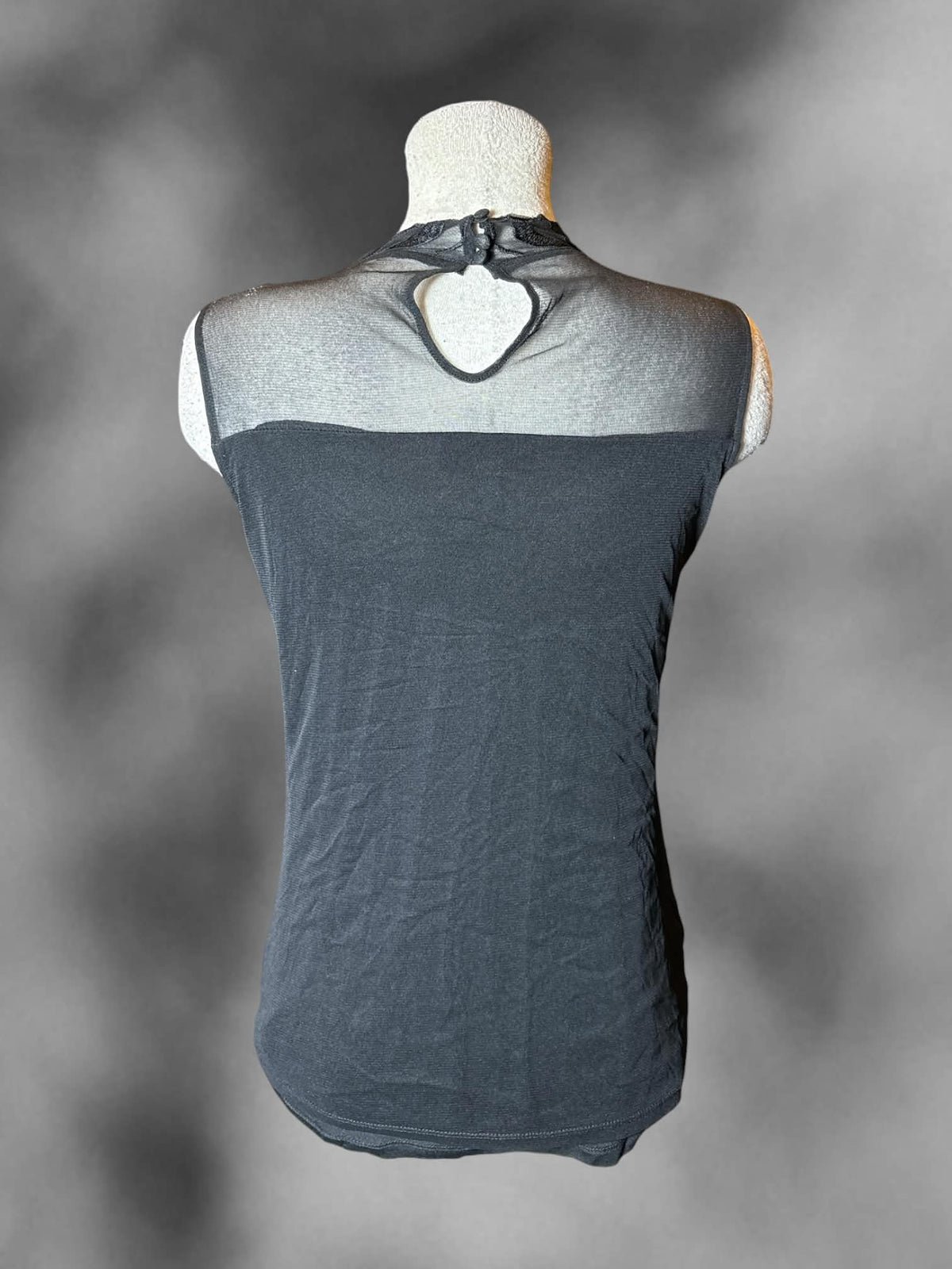 L International Concepts black turtleneck blouse with sheer embroidered layer on front, and buttons on back