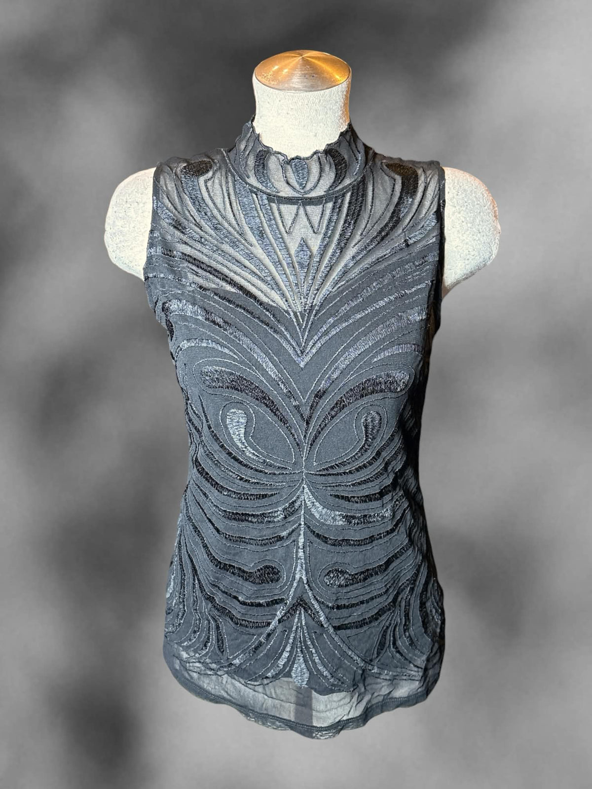 L International Concepts black turtleneck blouse with sheer embroidered layer on front, and buttons on back