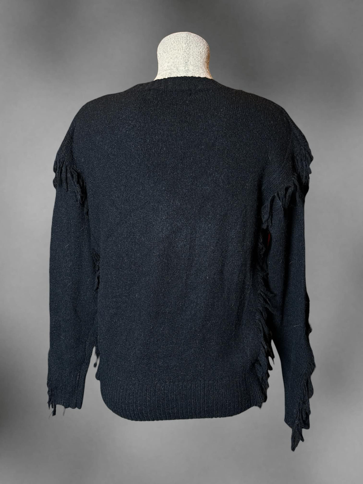 L Bishop + Young black knit sweater with distressed tassel design
