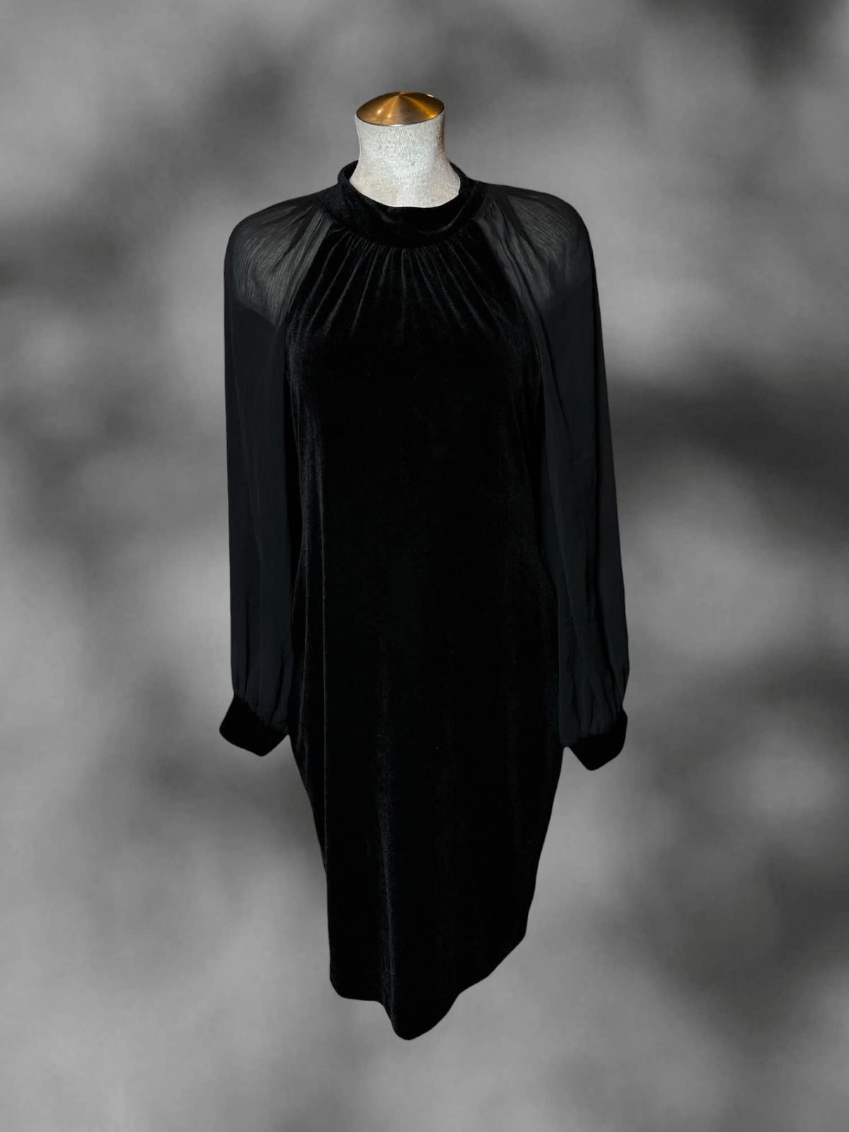 L Calvin Klein long-sleeve black velvet dress with sheer mesh sleeves, and zipper on back