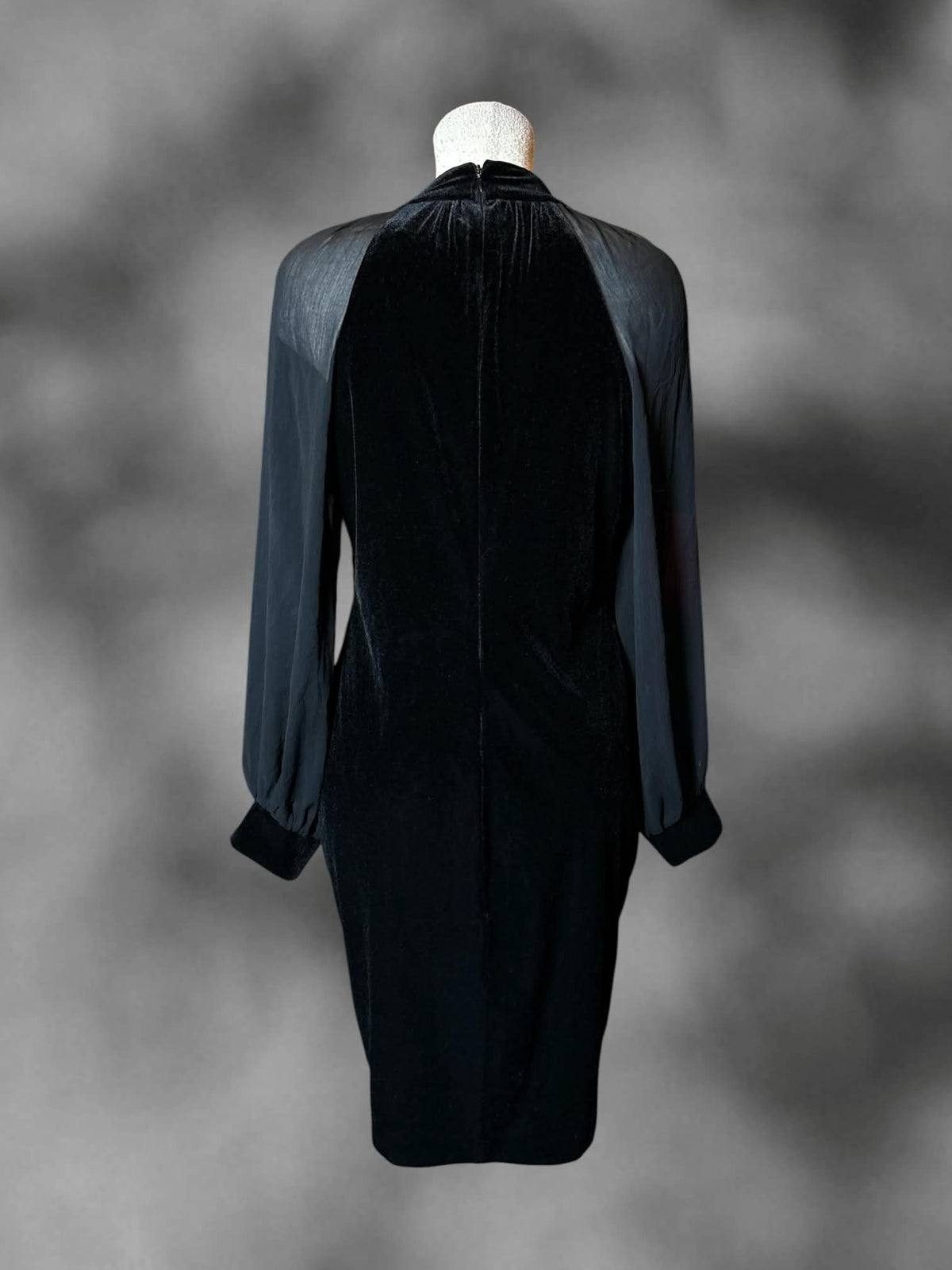 L Calvin Klein long-sleeve black velvet dress with sheer mesh sleeves, and zipper on back
