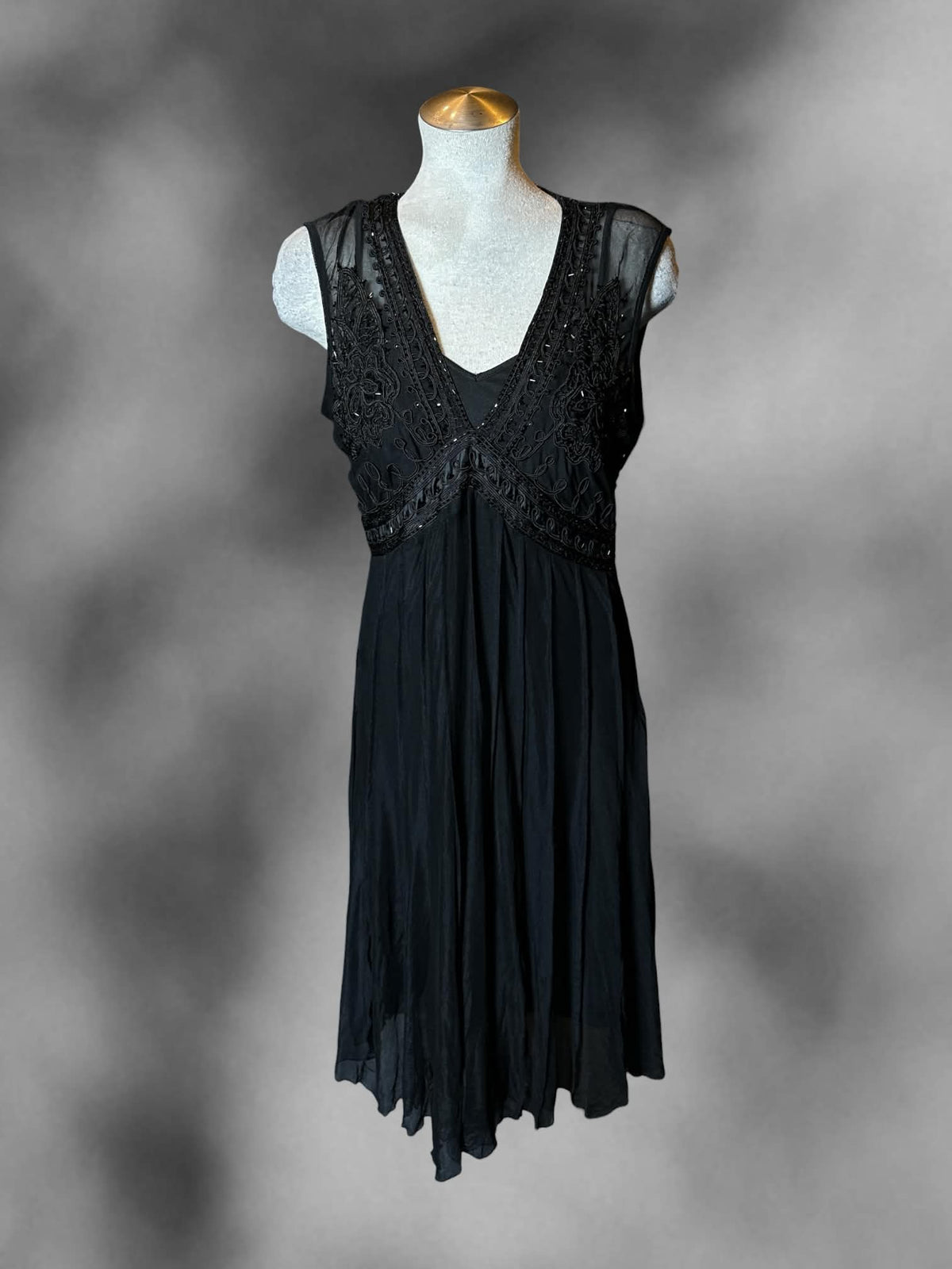 L ECI black two-piece dress with beaded embroidered design, pleated skirt, and adjustable straps
