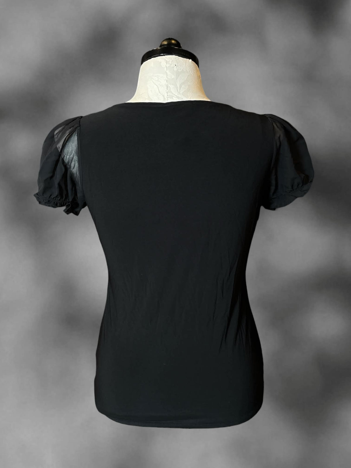 1X White House Black Market black blouse with sheer ruffle sleeves, and ruffle design on front