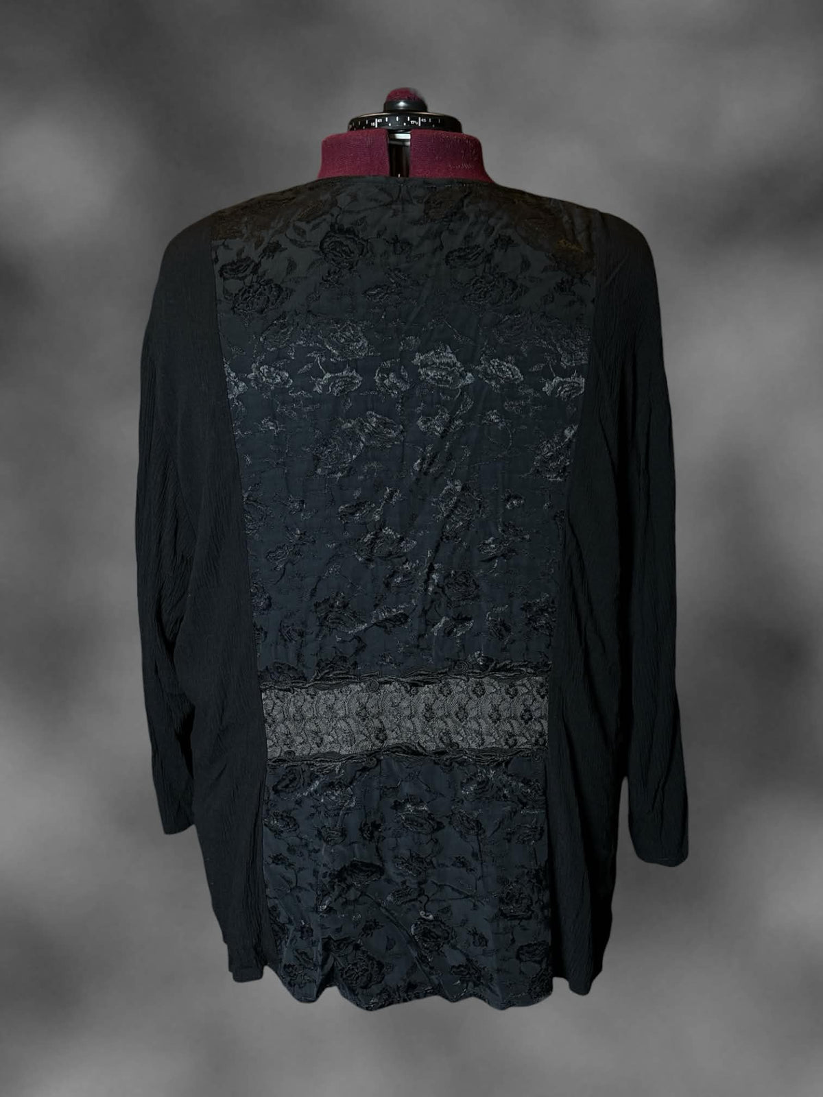 2X vintage black long-sleeve blouse with ruffle lace design, padded shoulders, and clasps and pockets on front
