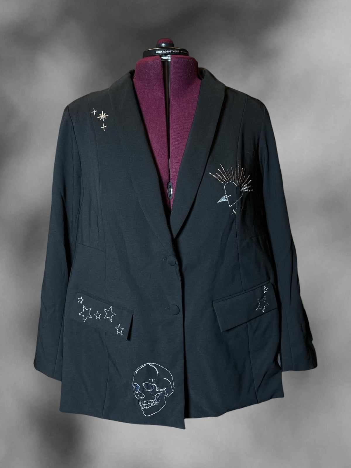 3X Studio New York black blazer with embroidered and beaded graphics on front and back, padded shoulders, and buttons on front