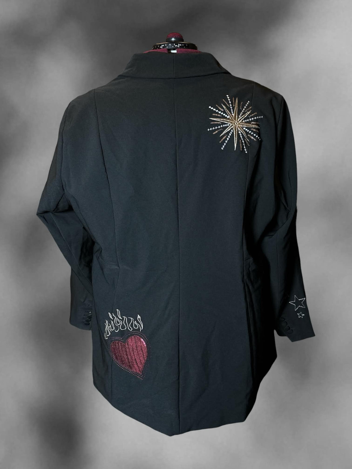3X Studio New York black blazer with embroidered and beaded graphics on front and back, padded shoulders, and buttons on front