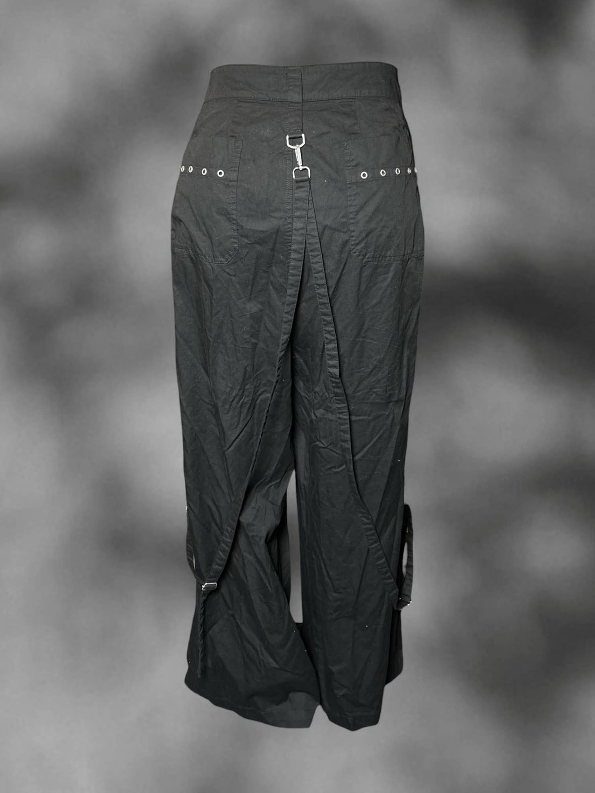 3X Torrid black high-waisted pants with zipper pockets, and decorative metallic loops