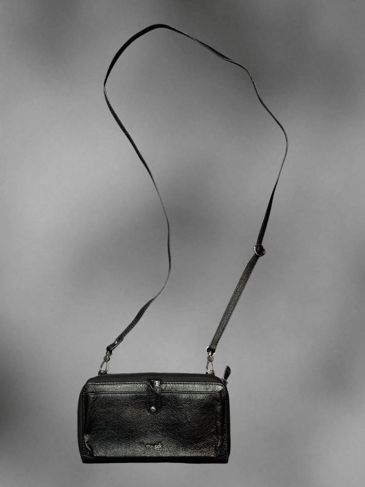 The Sak black faux leather shoulder bag with zipper pockets