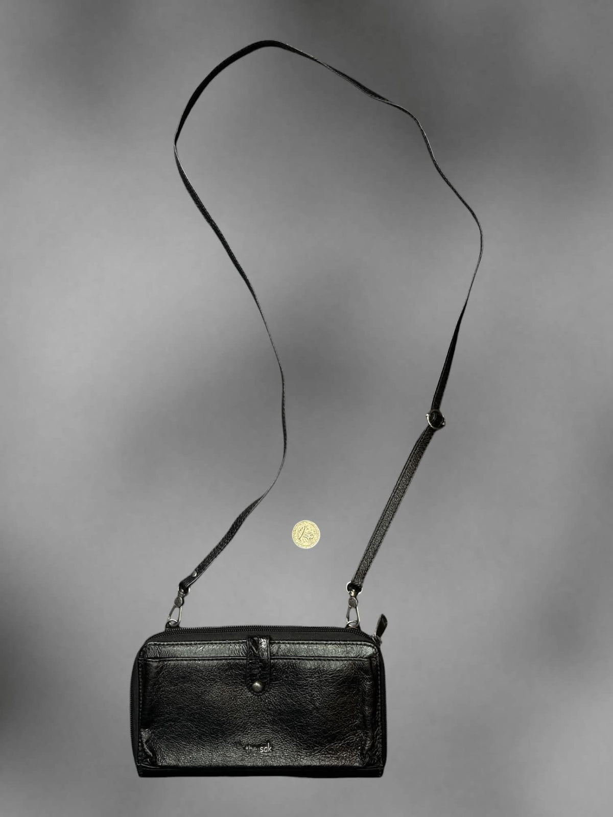 The Sak black faux leather shoulder bag with zipper pockets