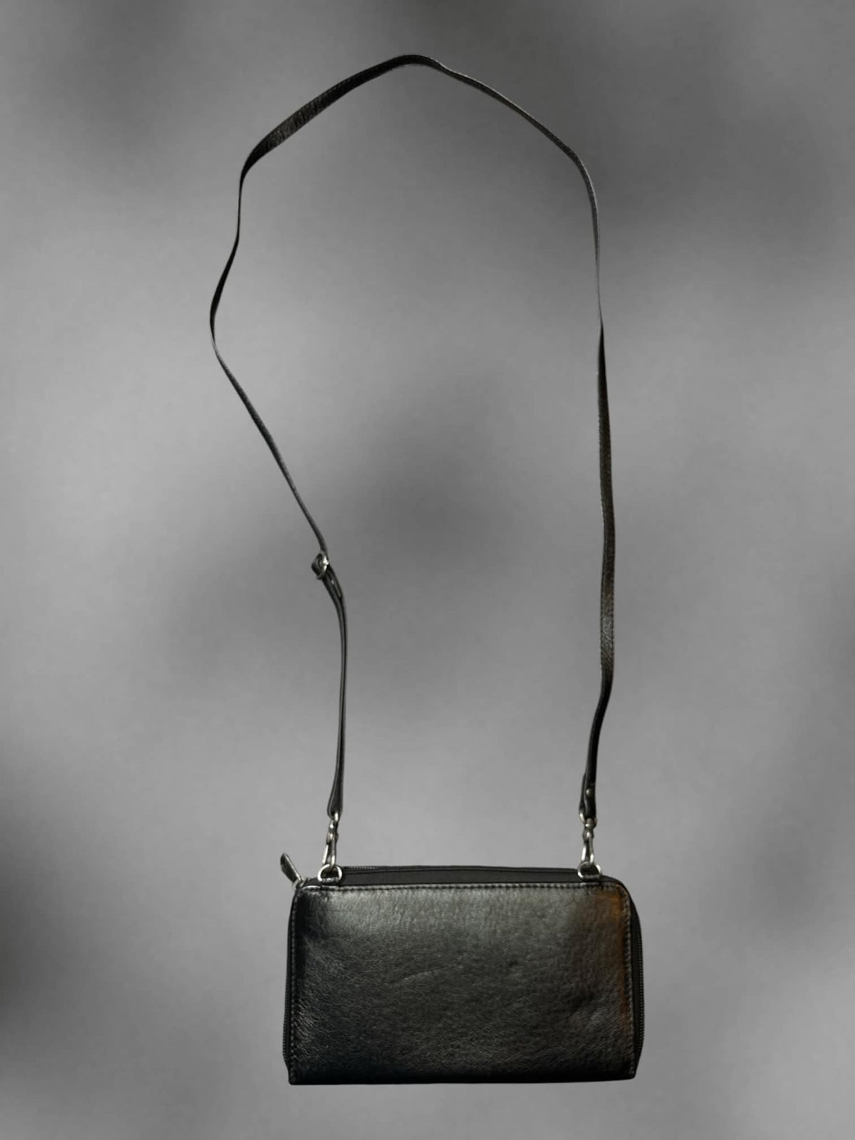 The Sak black faux leather shoulder bag with zipper pockets